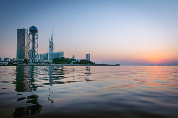 Panoamic View to Batumi coast and tourist attractions with romantic sunset in the bacground. Vacation holidays in caucasus. Georgian vegas.