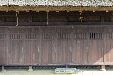 A traditional thatched roof Japanese house  preserved at a public park in Sanda, Hyogo, Japan.  