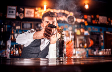 Barman makes a cocktail at the brasserie