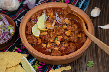 Vegan pozole rojo made with seitan, served in traditional mexican bowl