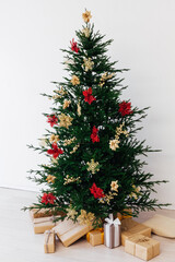 Christmas tree pine with decorations and gifts new year December