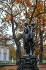 statue of a person in autumn park