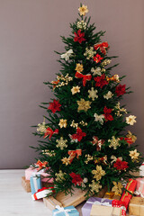 Christmas tree pine with new year gifts holiday red decoration decor gray background