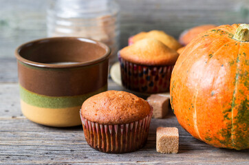 Freshly baked pumpkin muffins for coffee time. Traditional vegan and healthy sweets. Healthy food concept.