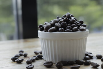 Coffee beans on cup in a cafe.