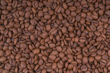 Fresh roasted coffee beans background texture, close up