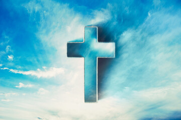 Shining cross in clouds on blue sky. Copy space. Ascension day concept. Christian Easter. Faith in...