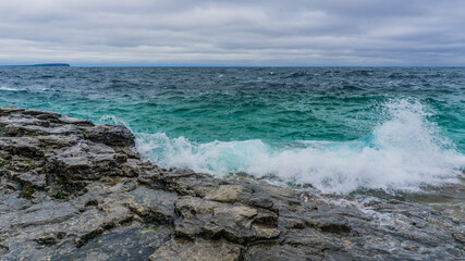 To the grotto, a natural wonder in Bruce Peninsula National Park. This park is protecting a rugged shore of the Lake Huron with turquoise blue waters