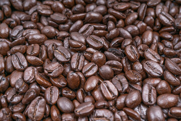 Fresh roasted coffee beans background texture, close up