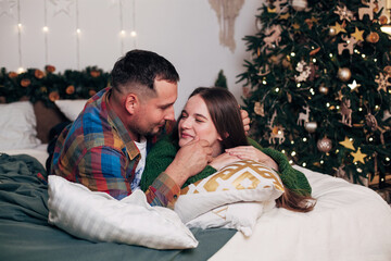 lovers hugs in bed in winter