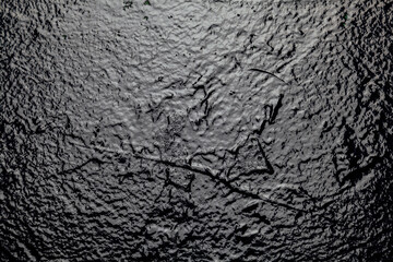 black wall illuminated by light texture structure background