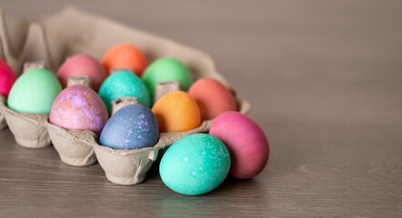 Fototapeta na wymiar Colorful Easter Eggs in Egg Carton