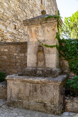 old stone fountain in a provencal village