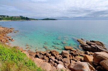 Children swimming in the rocks at Trebeurden in Brittany. France