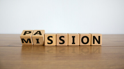 Do your mission with passion. Fliped wooden cubes and changed the inscription 'mission' to 'passion' or vice versa. Beautiful wooden table, white background, copy space. - obrazy, fototapety, plakaty