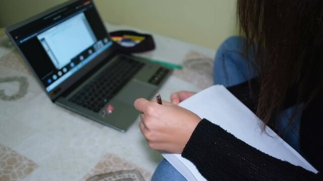 Left handed woman studying on smart school video call,covid-19 pandemic disease,tech university