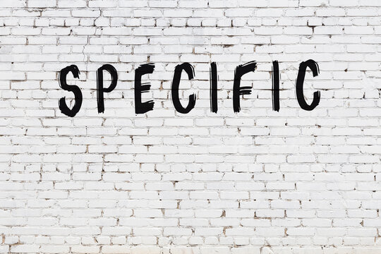 White wall with black paint inscription specific on it