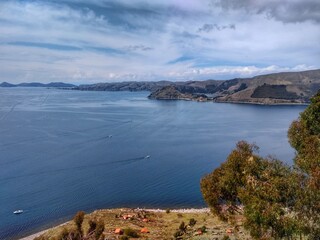 Lago Titicaca, Copacabana, Bolivia - Lake Titicaca, Between Peru and Bolivia in the Andes Mountains, is one of South America's largest lakes and the world’s highest navigable body of water.
