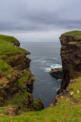 Eshaness Cliffs on the western coastline on Shetlands Mainland during a cloudy summer day
