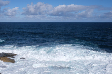 waves crashing on rocks