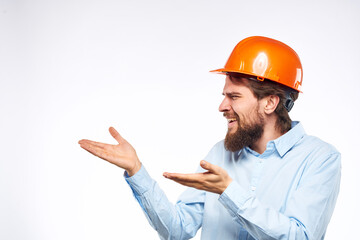 emotional man in work uniform gesturing with his hands an official construction professional