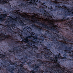 front view to rocks texture in the evening light