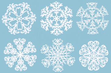 Obraz na płótnie Canvas Set of hand drawn Snowflakes on blue background. Snowflakes template. . Winter christmas snowflake element collection.