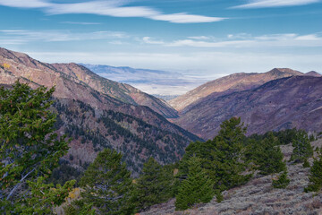 Butterfield Peak views of Oquirrh range toward Provo, Tooele, Utah Lake and Salt Lake County by Rio Tinto Bingham Copper Mine, in fall. Utah. United States.