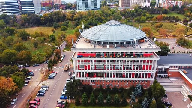 Aerial drone view of university campus among greenery and dwelling houses. Bucharest, Romania