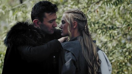 Movie about the medieval ages, a man in fur coat is taking off womans dress, 4k - Powered by Adobe