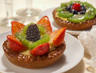 Mono-portion cake, dessert with strawberry and blueberry
