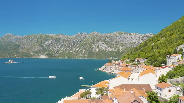 Perast, Montenegro. Aerial top view of the cityscape and St. Nicholas Church 