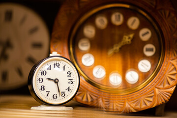 Old wooden clocks on the table
