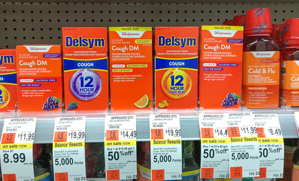 Packs Of Cough Medicine A Drug Store Shelf.