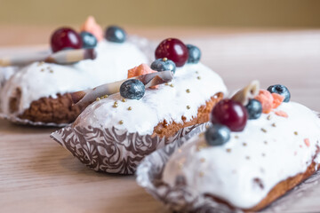 three eclairs with custard in a bakery