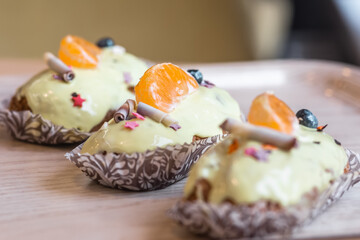 three eclairs with custard in a bakery