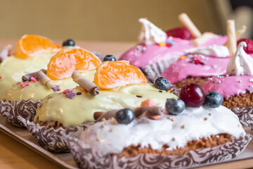 three eclairs with custard in a bakery