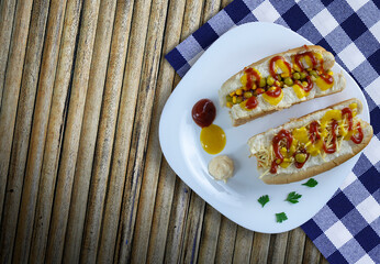 Hot dog with yellow mustard, ketchup, peas and corn