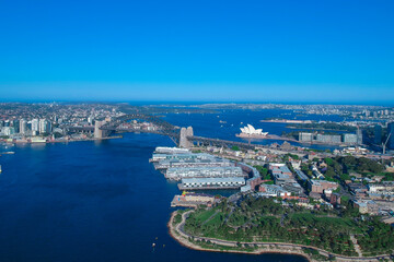 Fototapeta na wymiar Panoramic Aerial views of Sydney Harbour with the bridge, CBD, North Sydney, Barangaroo, Lavender Bay and boats in view