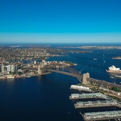 Fototapeta na wymiar Panoramic Aerial views of Sydney Harbour with the bridge, CBD, North Sydney, Barangaroo, Lavender Bay and boats in view