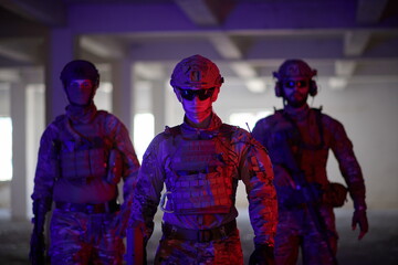 soldier squad team portrait in urban environment colored lightis