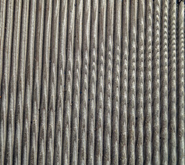 unusual radial pattern on a wooden old ribbed board photographed close-up. wood abstract background