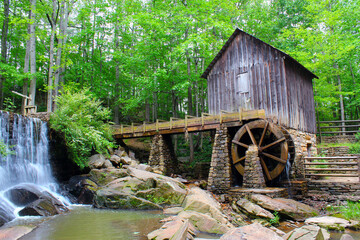 An historic mill near Marietta with green leafs in late spring.	
