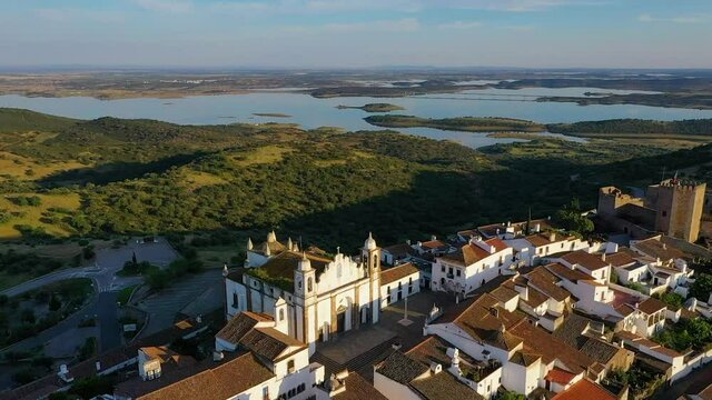 Aerial view of the Monsaraz Castle on a hill overlooking countryside, Portugal.