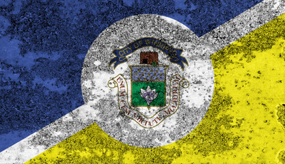 Flag of Winnipeg painted on the old grunge rustic iron surface. Abstract paint of Winnipeg national flag on the iron surface