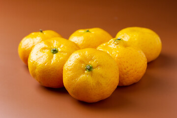 Small oranges on orange background