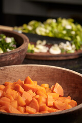 Vertical selective focus shot of chopped carrots