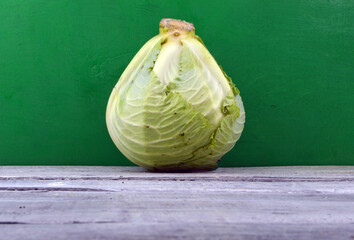 swing of fresh cabbage stiot on green wooden background