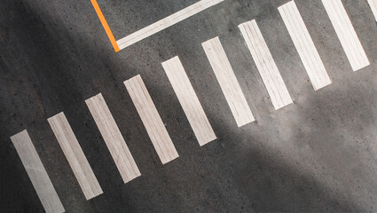 aerial view of abstract crosswalk on asphalt road. no people. copy space.