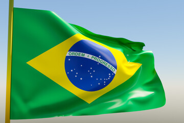 3D illustration of the national flag of Brazil on a metal flagpole fluttering against the blue sky.Country symbol.